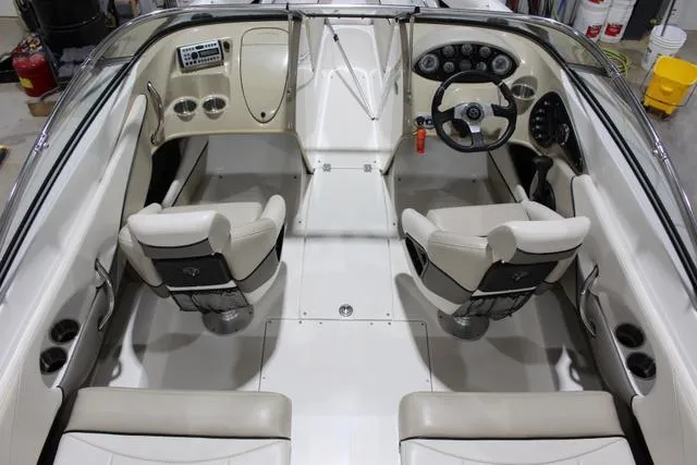Slide: The Image of 2007 Campion Allante 545i BR boat interior with beige seating and modern dashboard controls. - 13