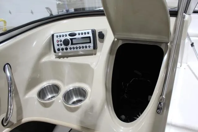 Slide: The Image of 2007 Campion Allante 545i BR boat dashboard with stereo and cup holders. - 21