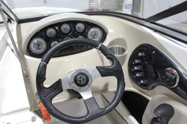 Slide: The Image of 2007 Campion Allante 545i BR boat dashboard with steering wheel and instrument panel. - 22