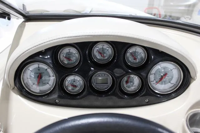 Slide: The Image of Dashboard of 2007 Campion Allante 545i BR boat with multiple gauges and carbon fiber finish. - 23