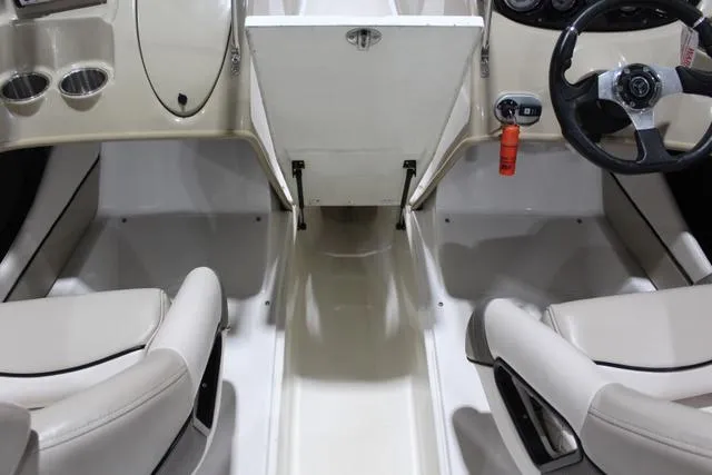 Slide: The Image of Interior of a 2007 Campion Allante 545i BR boat, featuring dual seating and steering wheel. - 27