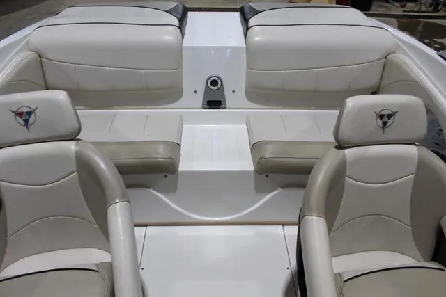 Slide: The Image of Interior of a 2007 Campion Allante 545i BR boat with white and beige seating. - 32