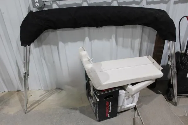 Slide: The Image of 2007 Campion Allante 545i BR boat parts, including a black bimini top and white seat. - 34