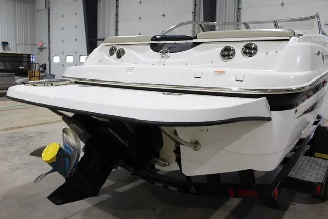 Slide: The Image of 2007 Campion Allante 545i BR boat in a garage, rear view showing propeller and swim platform. - 7