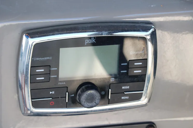 Slide: The Image of Polk audio system in 2018 Stingray 212 SC boat dashboard. - 39