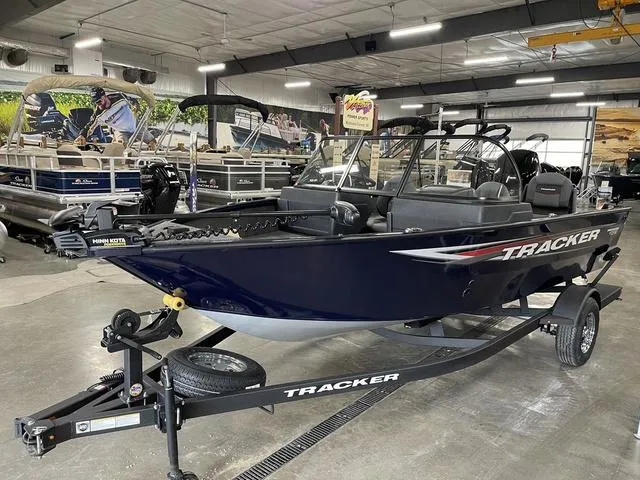 Slide: The Image of 2025 Tracker Pro Guide™ V-175 Combo boat on trailer in showroom. - 10