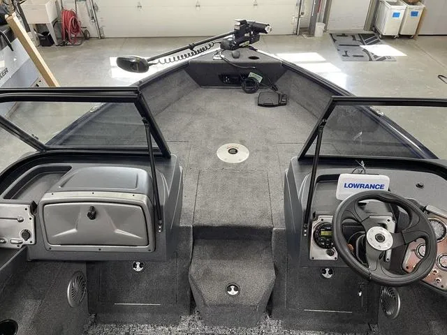 Slide: The Image of 2025 Tracker Pro Guide™ V-175 Combo boat interior with steering wheel and navigation equipment. - 13