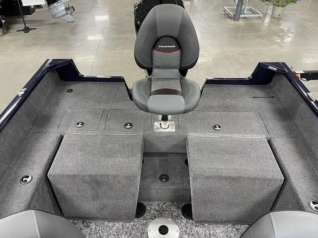 Slide: The Image of 2025 Tracker Pro Guide™ V-175 Combo boat interior with gray seating and storage compartments. - 29