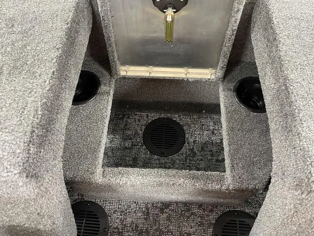 Slide: The Image of 2025 Tracker Pro Guide™ V-175 Combo interior with carpeted flooring and storage compartments. - 30