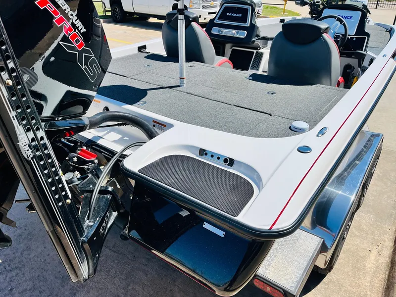 Slide: The Image of 2022 Caymas CX 21 PRO boat, rear view, showcasing deck and seating. - 10