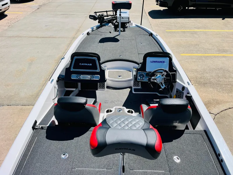 Slide: The Image of 2022 Caymas CX 21 PRO boat interior with seating and navigation equipment. - 11