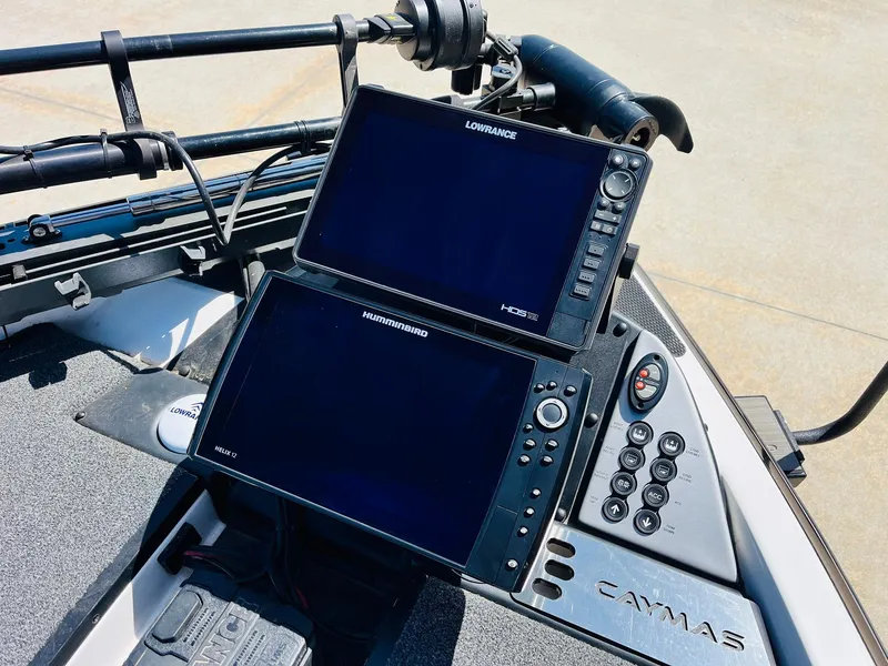 Slide: The Image of 2022 Caymas CX 21 PRO boat dashboard with Lowrance and Humminbird navigation systems. - 16