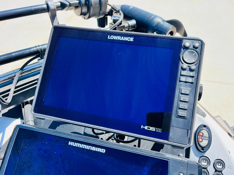 Slide: The Image of Lowrance and Humminbird fish finders on 2022 Caymas CX 21 PRO boat dashboard. - 17