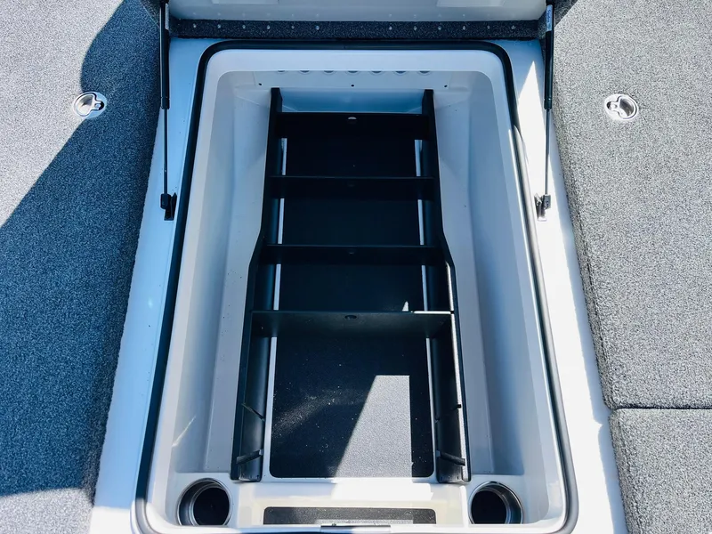 Slide: The Image of 2022 Caymas CX 21 PRO boat storage compartment with organized interior layout. - 24
