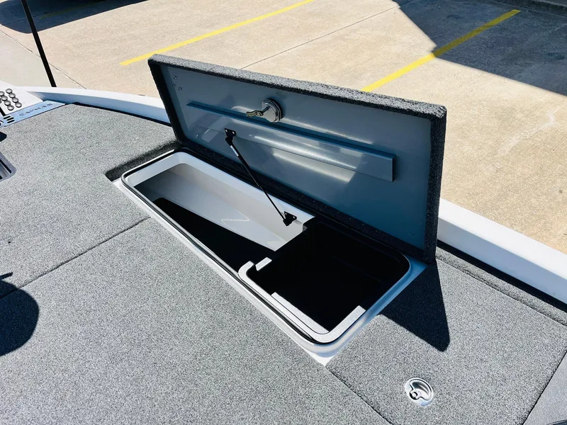 Slide: The Image of 2022 Caymas CX 21 PRO boat storage compartment open, showcasing interior space. - 25
