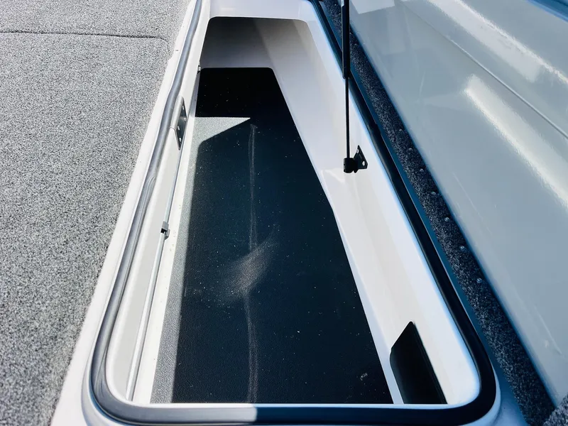Slide: The Image of Storage compartment of 2022 Caymas CX 21 PRO boat, featuring spacious interior and sleek design. - 27
