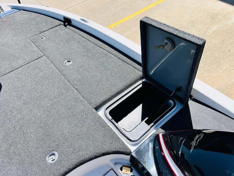 Slide: The Image of 2022 Caymas CX 21 PRO boat deck with open storage compartment. - 28