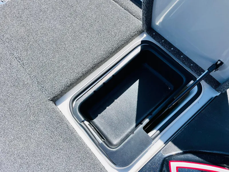 Slide: The Image of Storage compartment in 2022 Caymas CX 21 PRO boat, open lid, carpeted interior. - 29