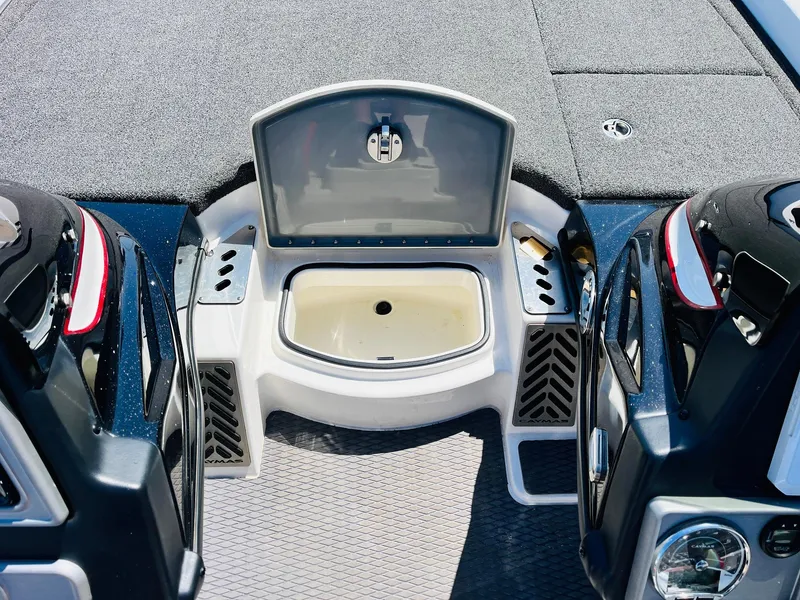 Slide: The Image of 2022 Caymas CX 21 PRO boat interior with open storage compartment and sleek design. - 33