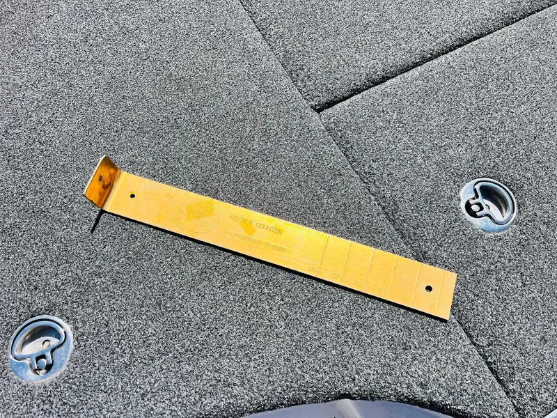 Slide: The Image of Golden ruler on Caymas CX 21 PRO 2022 boat deck with metal latches. - 34