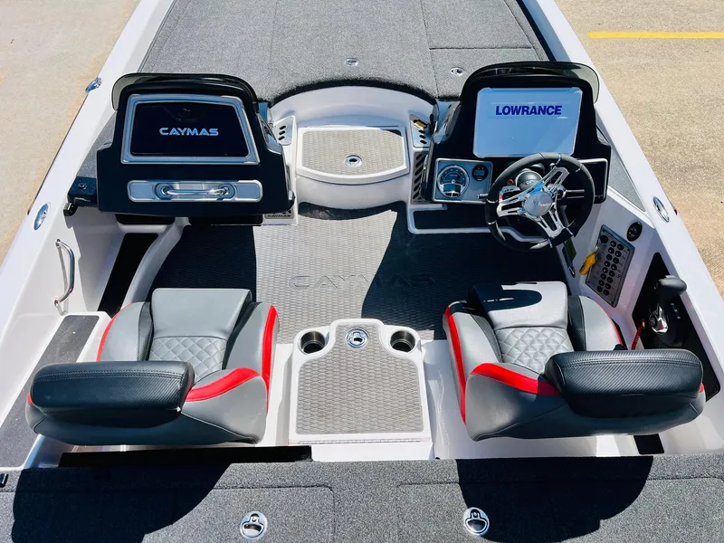 Slide: The Image of 2022 Caymas CX 21 PRO boat interior with dual seats and advanced dashboard. - 36