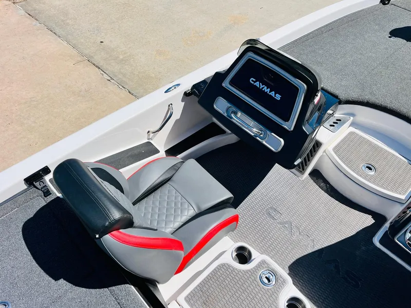 Slide: The Image of 2022 Caymas CX 21 PRO boat interior with sleek seating and modern dashboard design. - 37