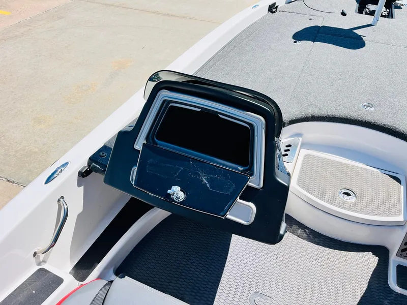 Slide: The Image of 2022 Caymas CX 21 PRO boat interior with open storage compartment. - 38