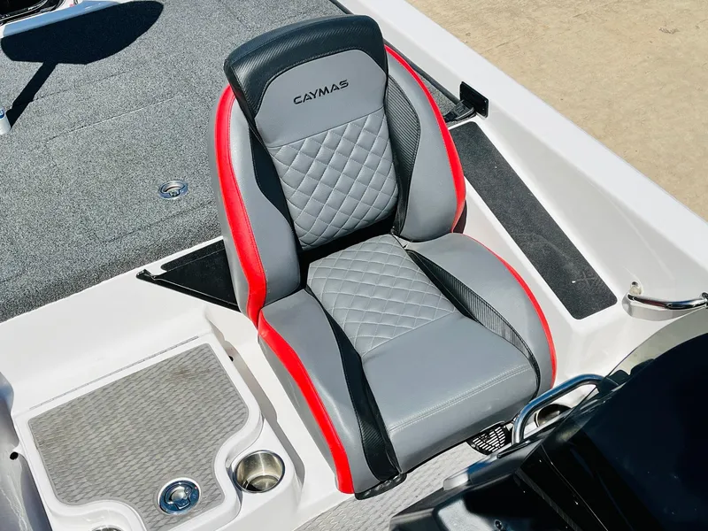Slide: The Image of Caymas CX 21 PRO 2022 boat seat with gray, red, and black design. - 47
