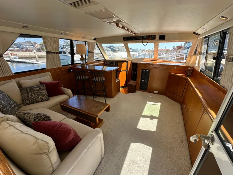 Slide: The Image of Luxurious interior of 1998 Riviera 43 Open Flybridge yacht with elegant furnishings. - 7