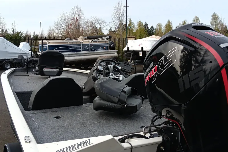 Slide: The Image of 2022 Tracker Pro Team 190 TX boat with Mercury Pro XS engine, parked outdoors. - 4