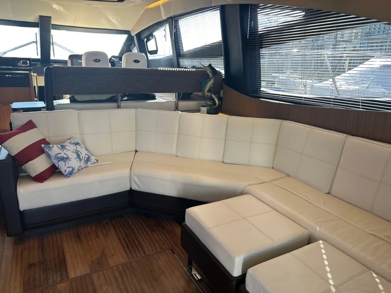 Slide: The Image of Luxurious interior of 2016 Sea Ray L590 Fly yacht with plush seating and elegant design. - 18