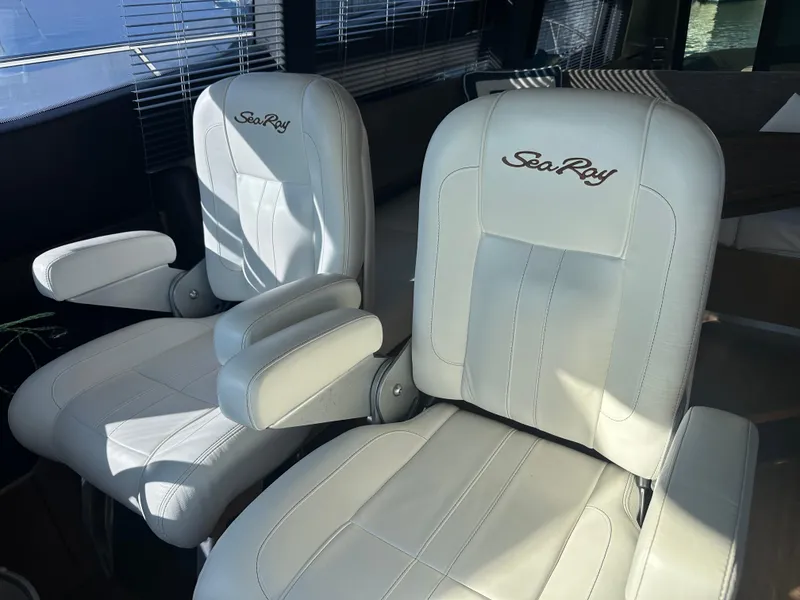 Slide: The Image of Luxurious white leather seats on a 2016 Sea Ray L590 Fly yacht. - 24