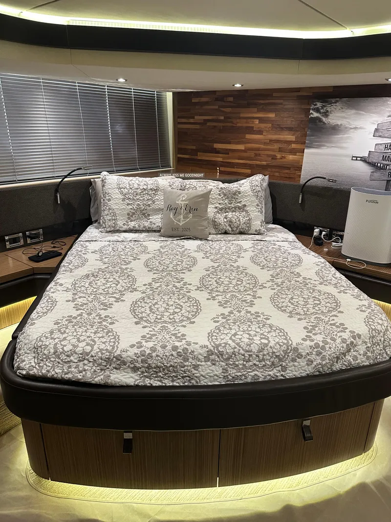 Slide: The Image of Luxurious bedroom interior of 2016 Sea Ray L590 Fly yacht with elegant bedding and ambient lighting. - 32