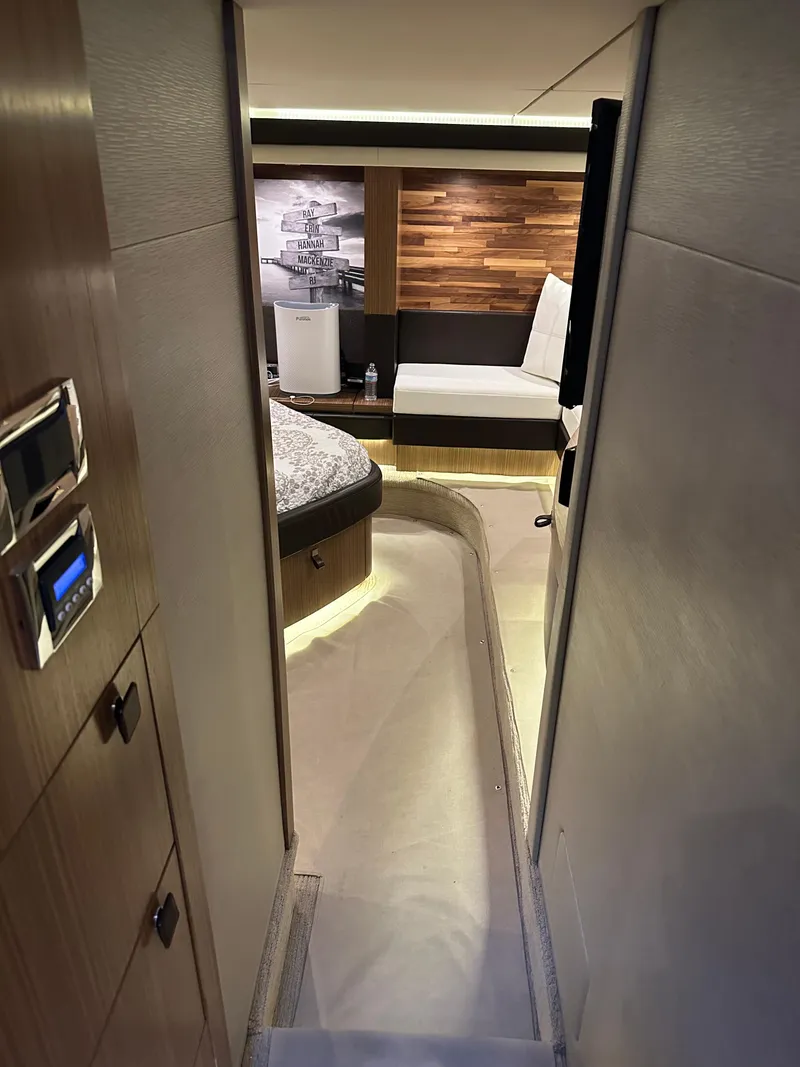 Slide: The Image of Interior view of 2016 Sea Ray L590 Fly yacht, featuring modern design and cozy seating area. - 35