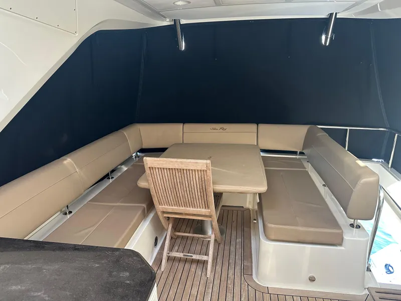 Slide: The Image of 2016 Sea Ray L590 Fly yacht with outdoor seating and dining area. - 43