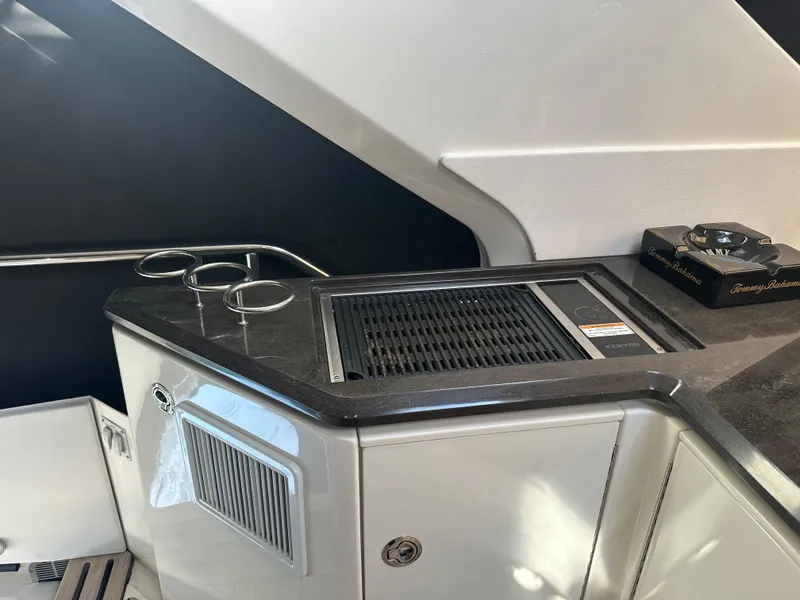 Slide: The Image of 2016 Sea Ray L590 Fly yacht interior with sleek kitchenette and modern design. - 45