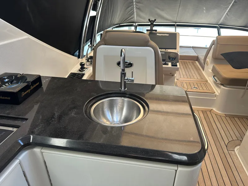 Slide: The Image of Luxurious 2016 Sea Ray L590 Fly yacht interior with sleek kitchenette and modern amenities. - 46