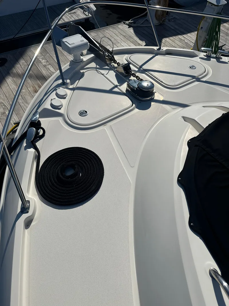 Slide: The Image of 2016 Sea Ray L590 Fly yacht deck with sleek design and modern fittings. - 7