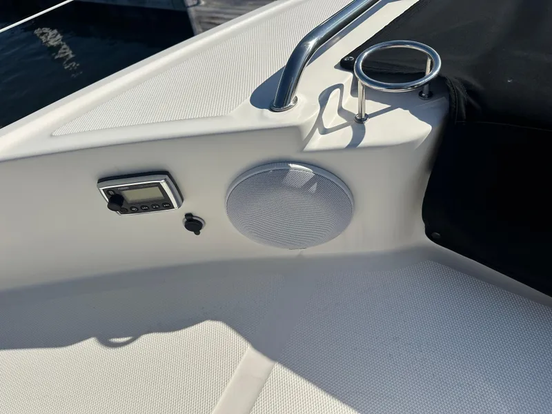 Slide: The Image of 2016 Sea Ray L590 Fly yacht deck with speaker and control panel. - 9