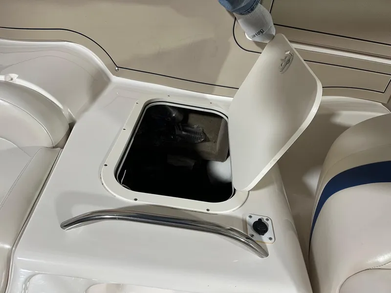 Slide: The Image of Open storage compartment on 2001 Chaparral Sunesta 263 boat interior. - 13