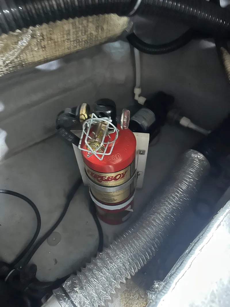 Slide: The Image of Fire extinguisher in 2001 Chaparral Sunesta 263 boat engine compartment. - 16
