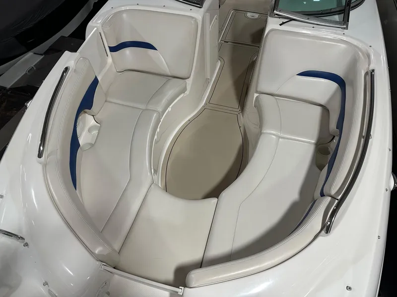 Slide: The Image of 2001 Chaparral Sunesta 263 boat interior with white and blue seating arrangement. - 26