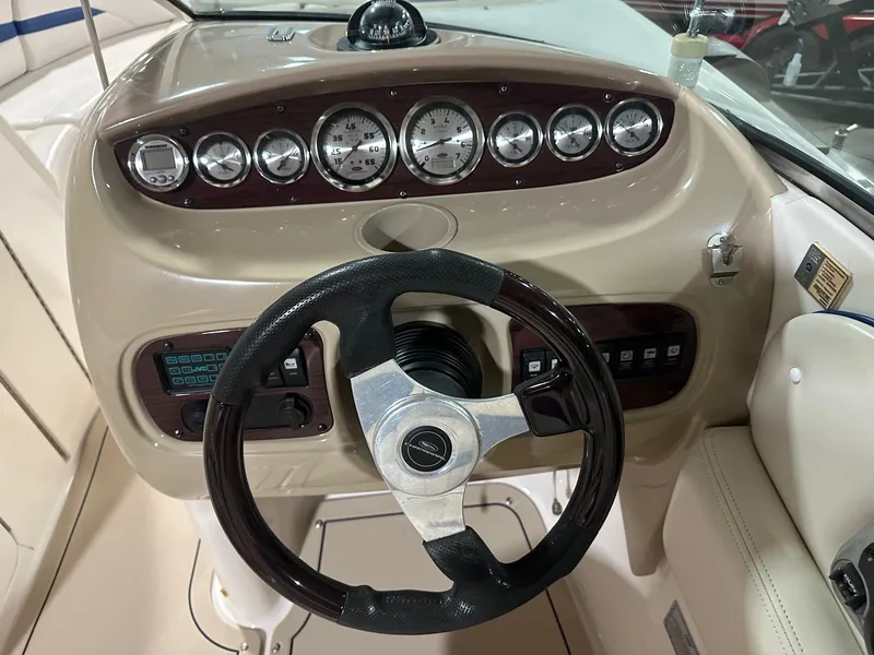 Slide: The Image of 2001 Chaparral Sunesta 263 dashboard with steering wheel and instrument panel. - 29