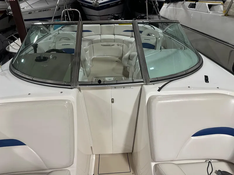 Slide: The Image of 2001 Chaparral Sunesta 263 boat interior with white seating and windshield. - 30