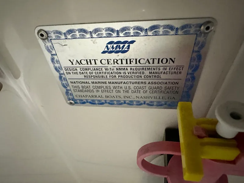 Slide: The Image of Yacht certification plaque on 2001 Chaparral Sunesta 263, NMMA compliance details. - 38