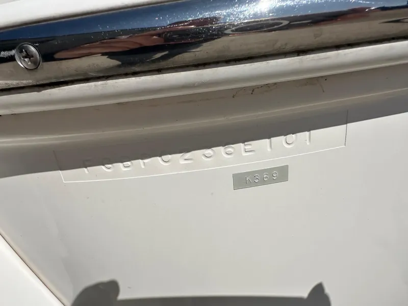 Slide: The Image of 2001 Chaparral Sunesta 263 boat hull identification number and metal plate detail. - 6