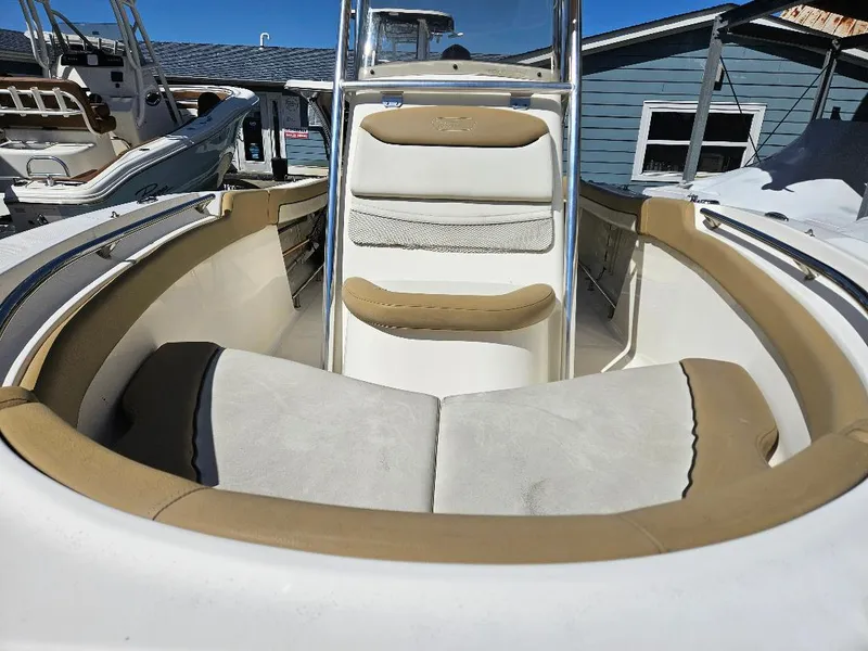 Slide: The Image of 2015 Pioneer Islander 197 boat interior with beige and white seating. - 10