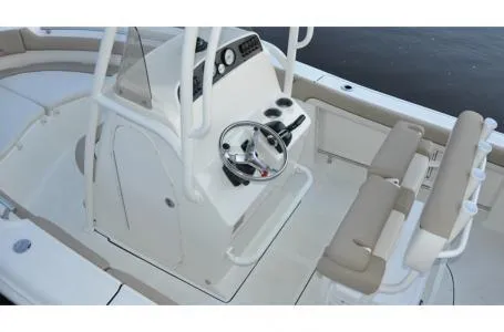 Slide: The Image of 2015 Pioneer Islander 197 boat interior with steering console and seating. - 14