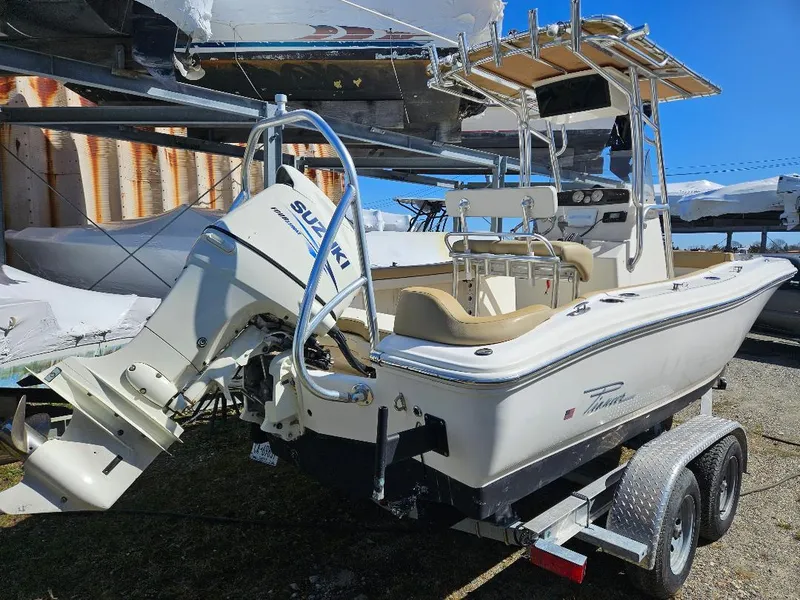 Slide: The Image of 2015 Pioneer Islander 197 boat with Suzuki outboard motor on a trailer. - 21