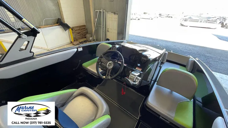 Slide: The Image of 2019 Heyday WT-1 boat interior with steering wheel and seating, displayed at Marine Center Indiana. - 12